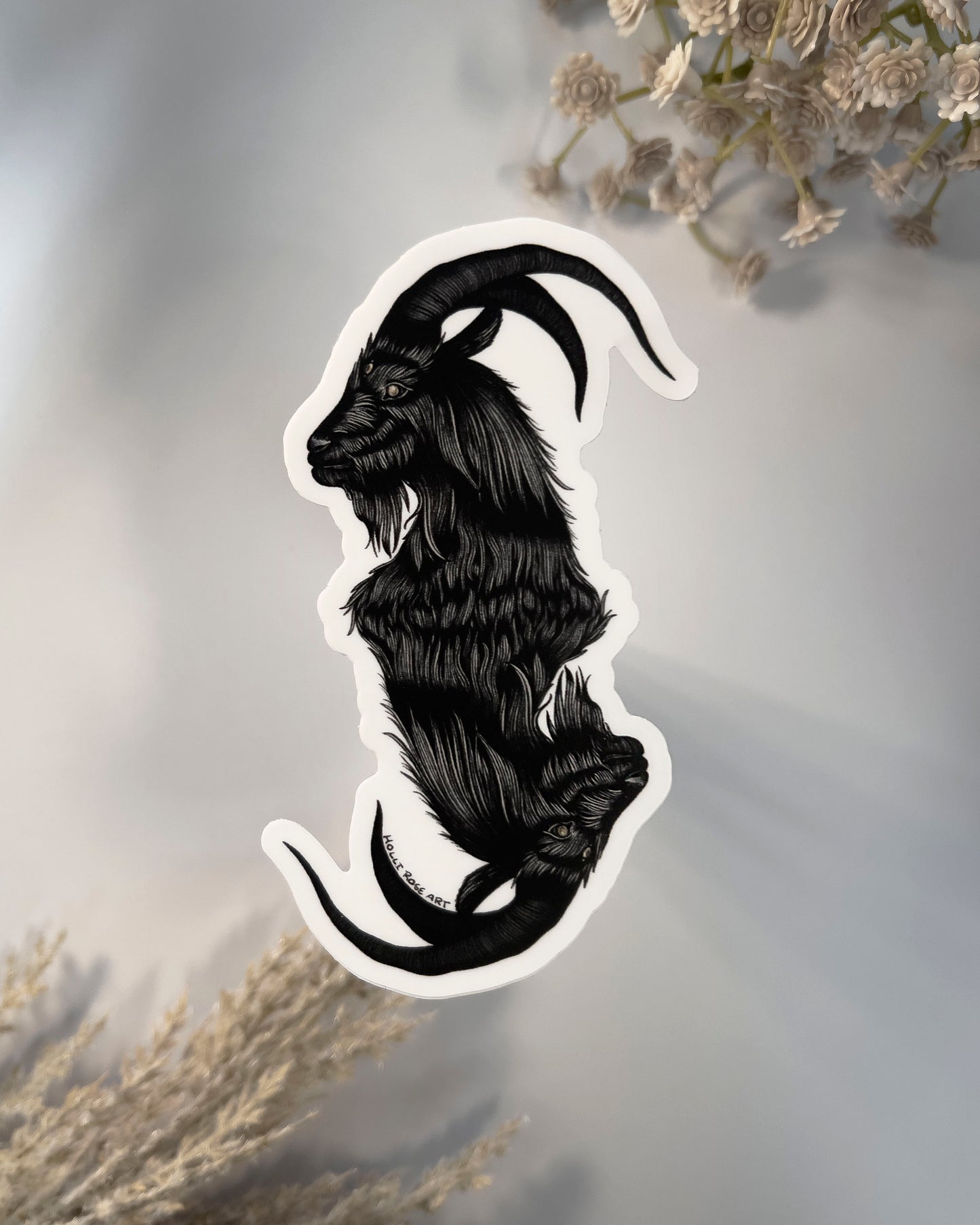 a sticker with a double headed goat 