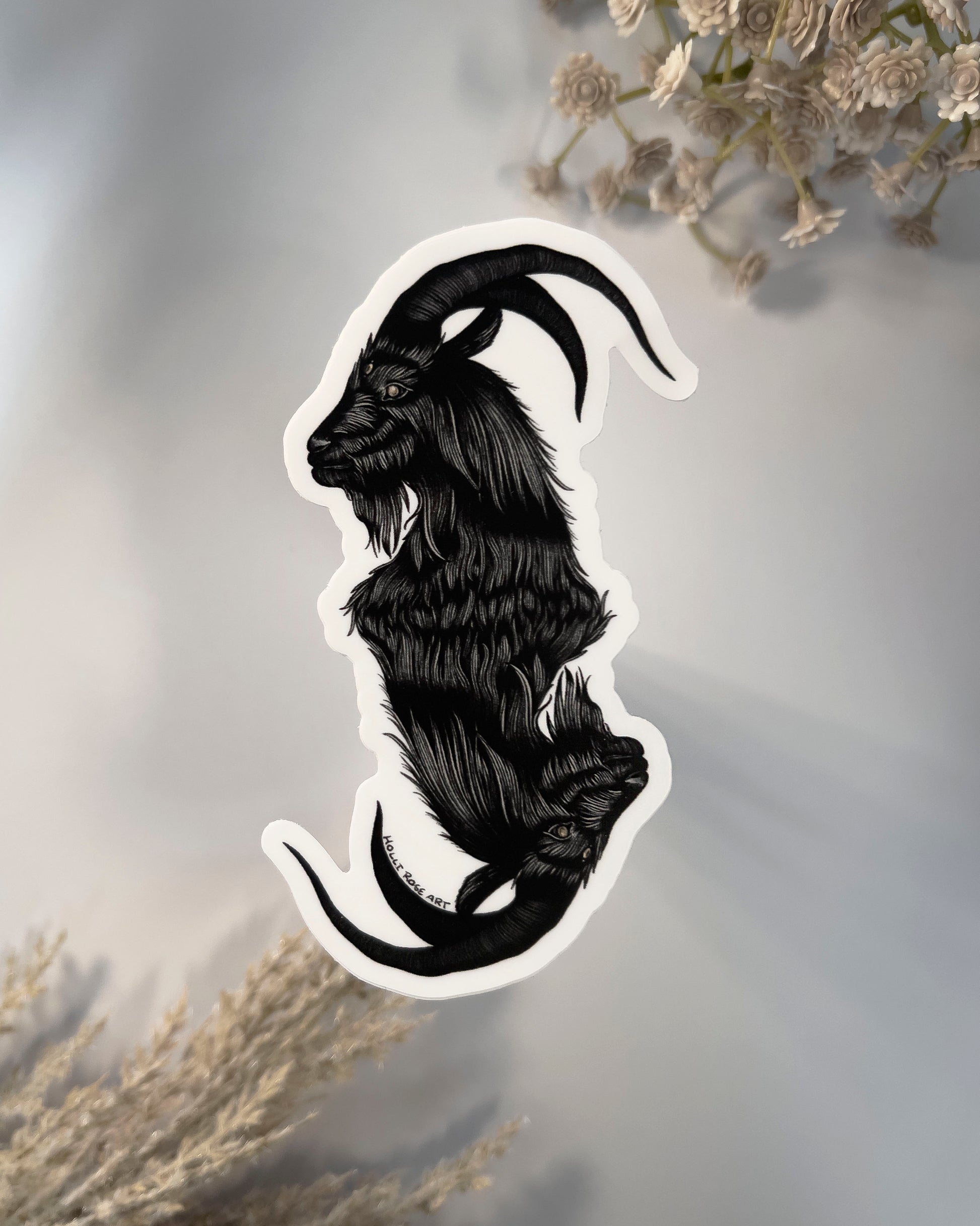 a sticker with a double headed goat 