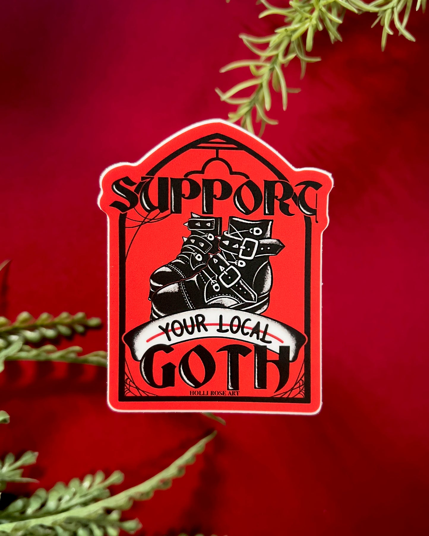 a sticker that says support your local goth with black goth boots