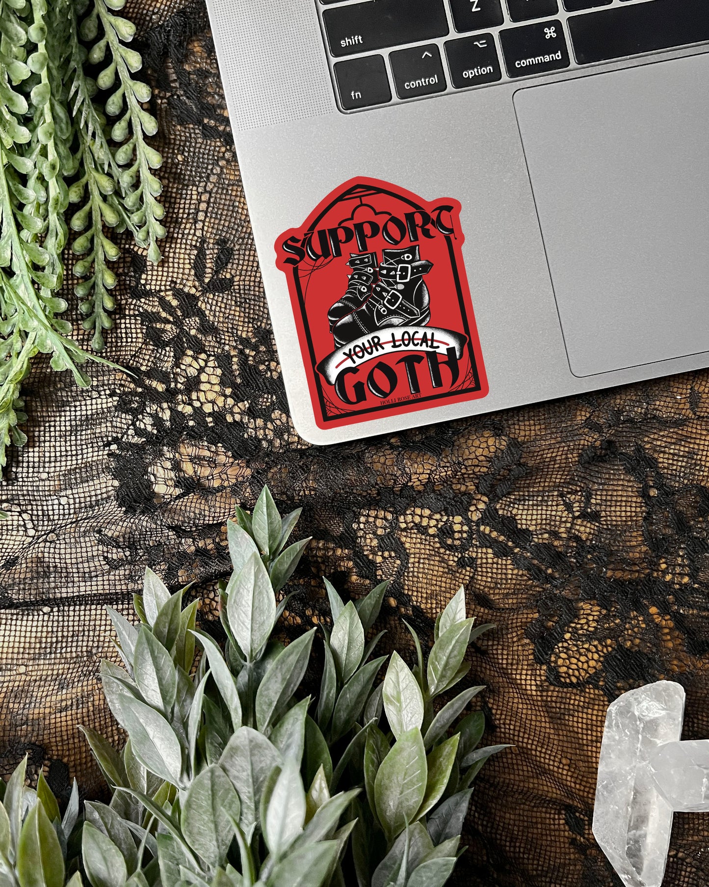 a sticker that says support your local goth with black goth boots