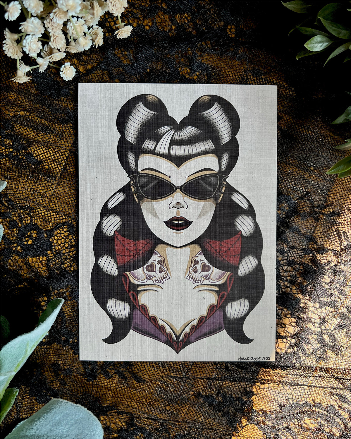 a goth girl wearing bat glasses with pinup haired skull tattoos on her neck. This is an art print