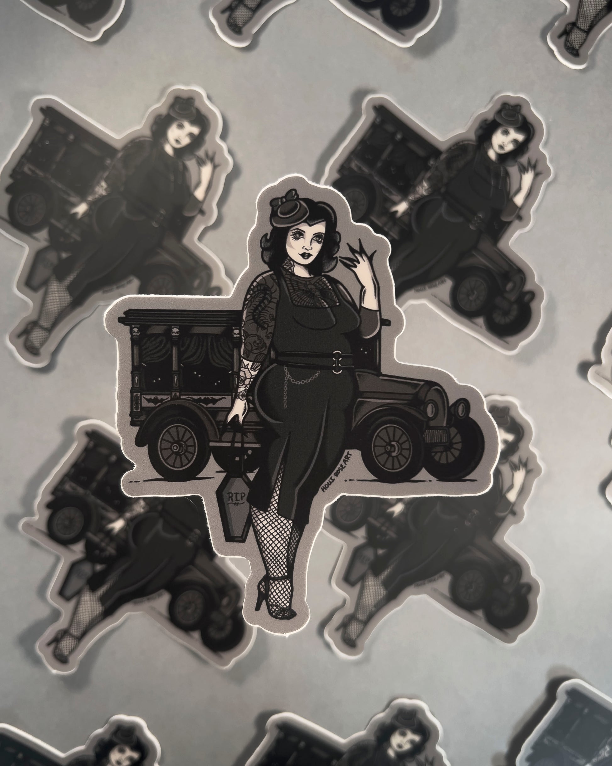 Goth girl sticker wearing a black dress with a black old vehicle behind her