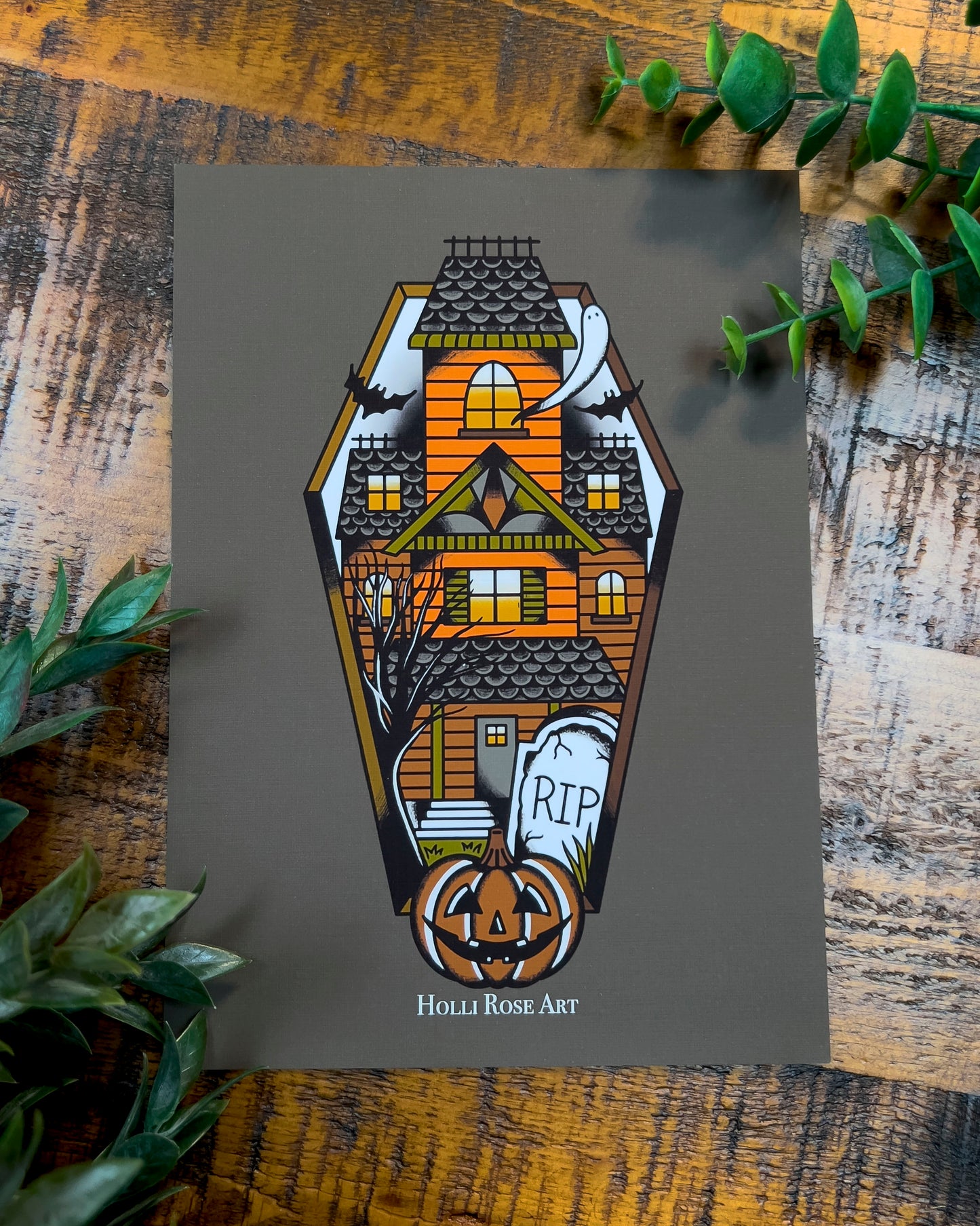 a haunted house in a coffin shape print