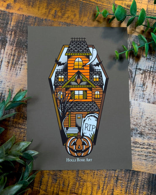 a haunted house in a coffin shape print