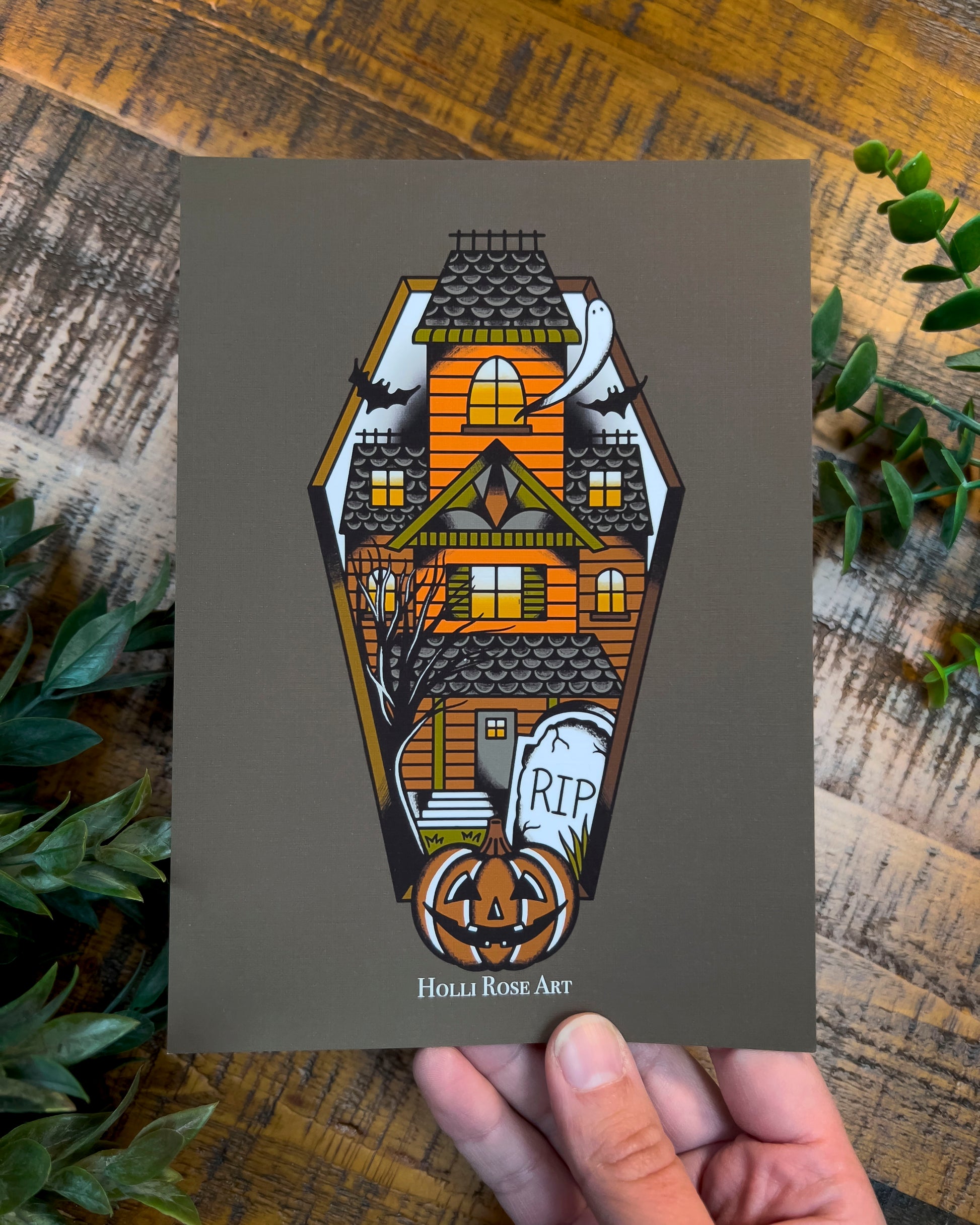 a haunted house in a coffin shape print