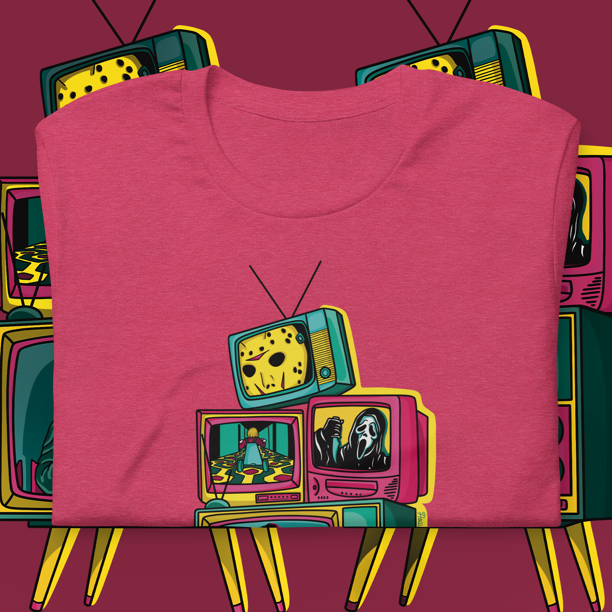 A heather raspberry colored t-shirt with a graphic print of multiple vintage television sets displaying various classic horror movie scenes.