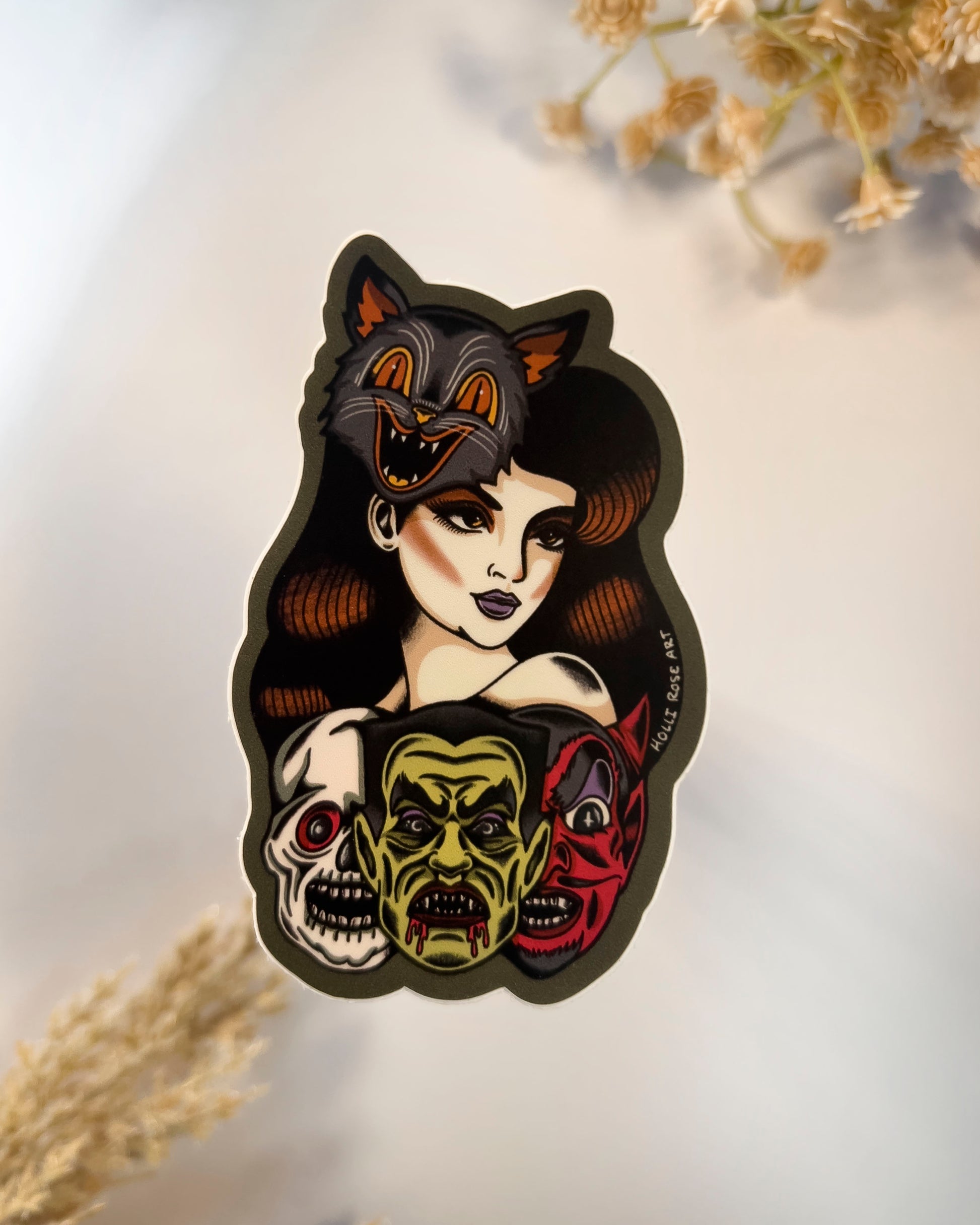Sticker of a woman wearing a cat mask and monster masks under her