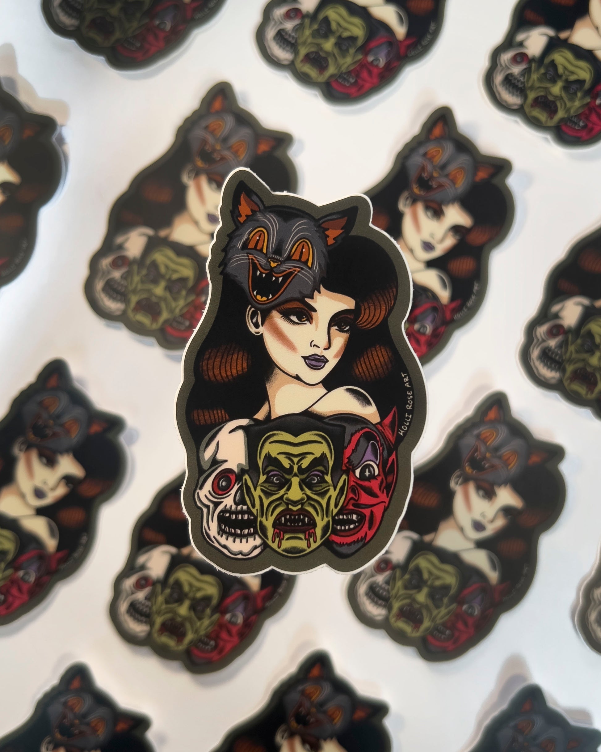 Sticker of a woman wearing a cat mask and monster masks under her