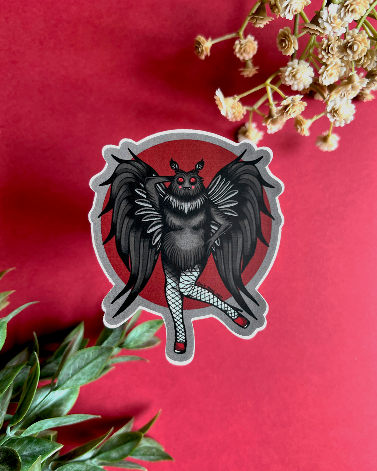 a sticker of a moth ma'am with sexy legs and heels
