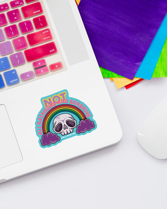 Sticker with a skull and rainbow design on a laptop