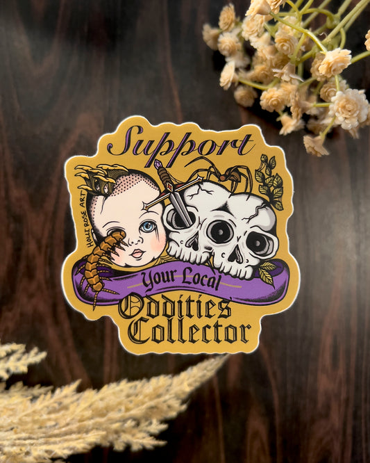 a sticker that says support your local oddities collector with a doll head, double headed skull, and bugs