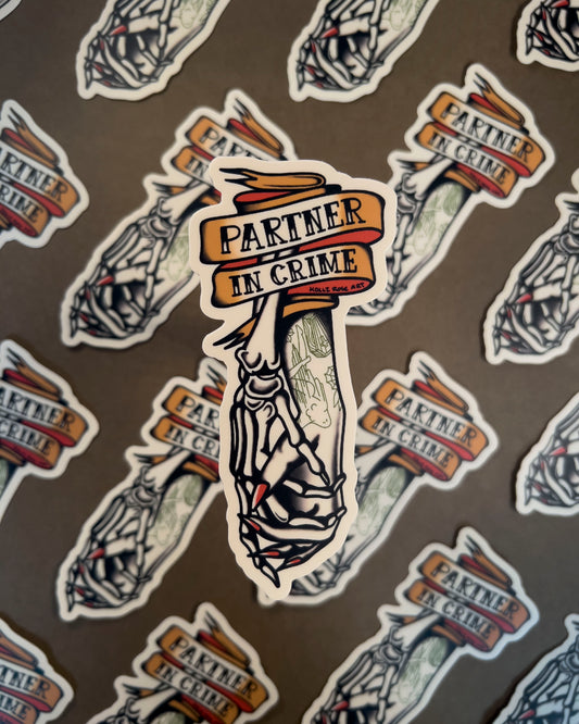 Sticker with the saying 'Partner in Crime' and a skeleton hand and human hand holding hands