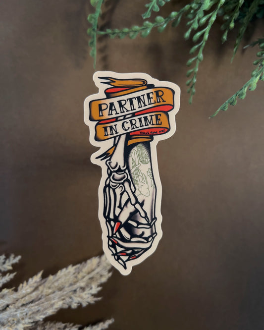 Sticker with the saying 'Partner in Crime' and a skeleton hand and human hand holding hands