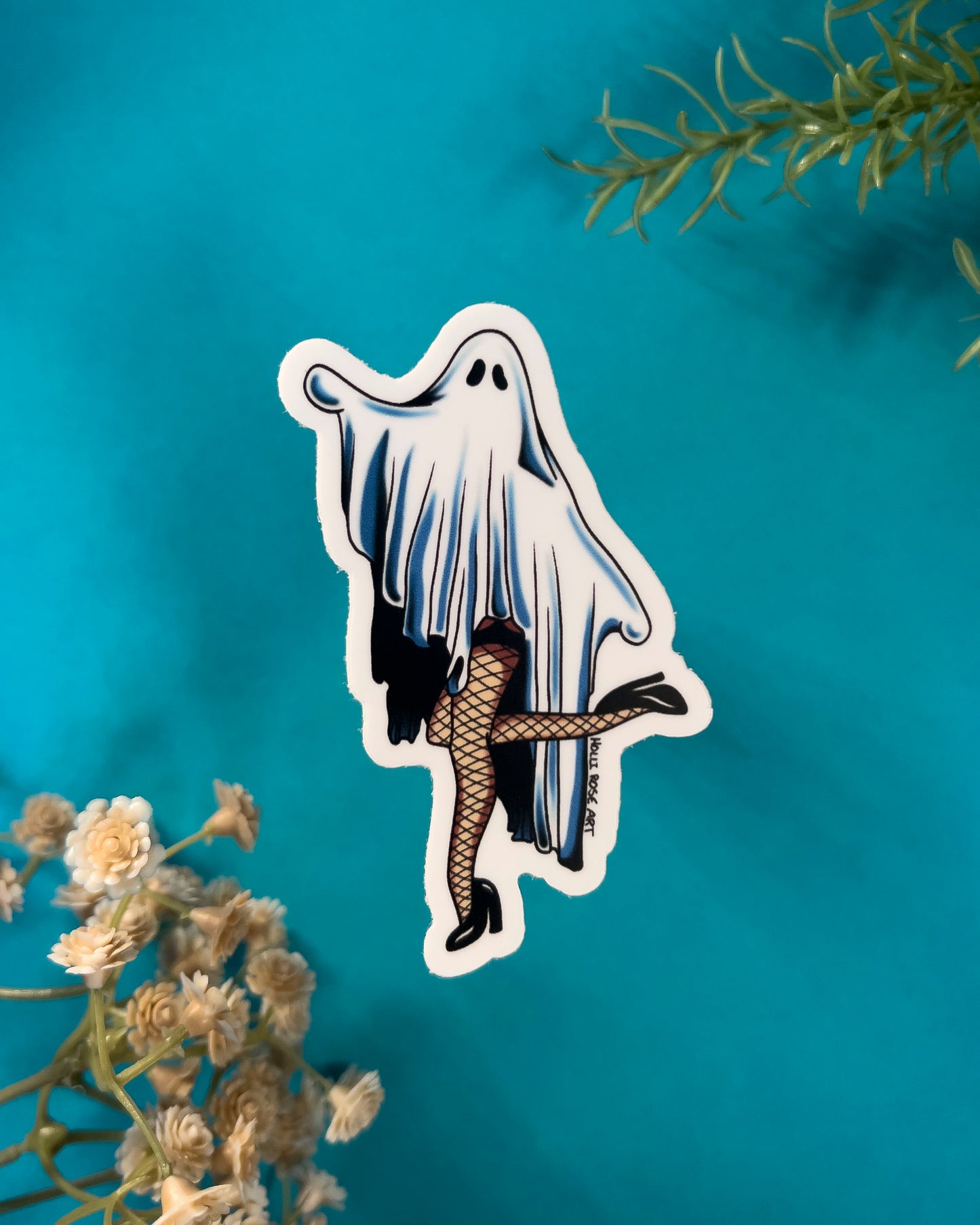 Sticker of a ghost in fishnet stockings on a teal background with flowers and leaves.