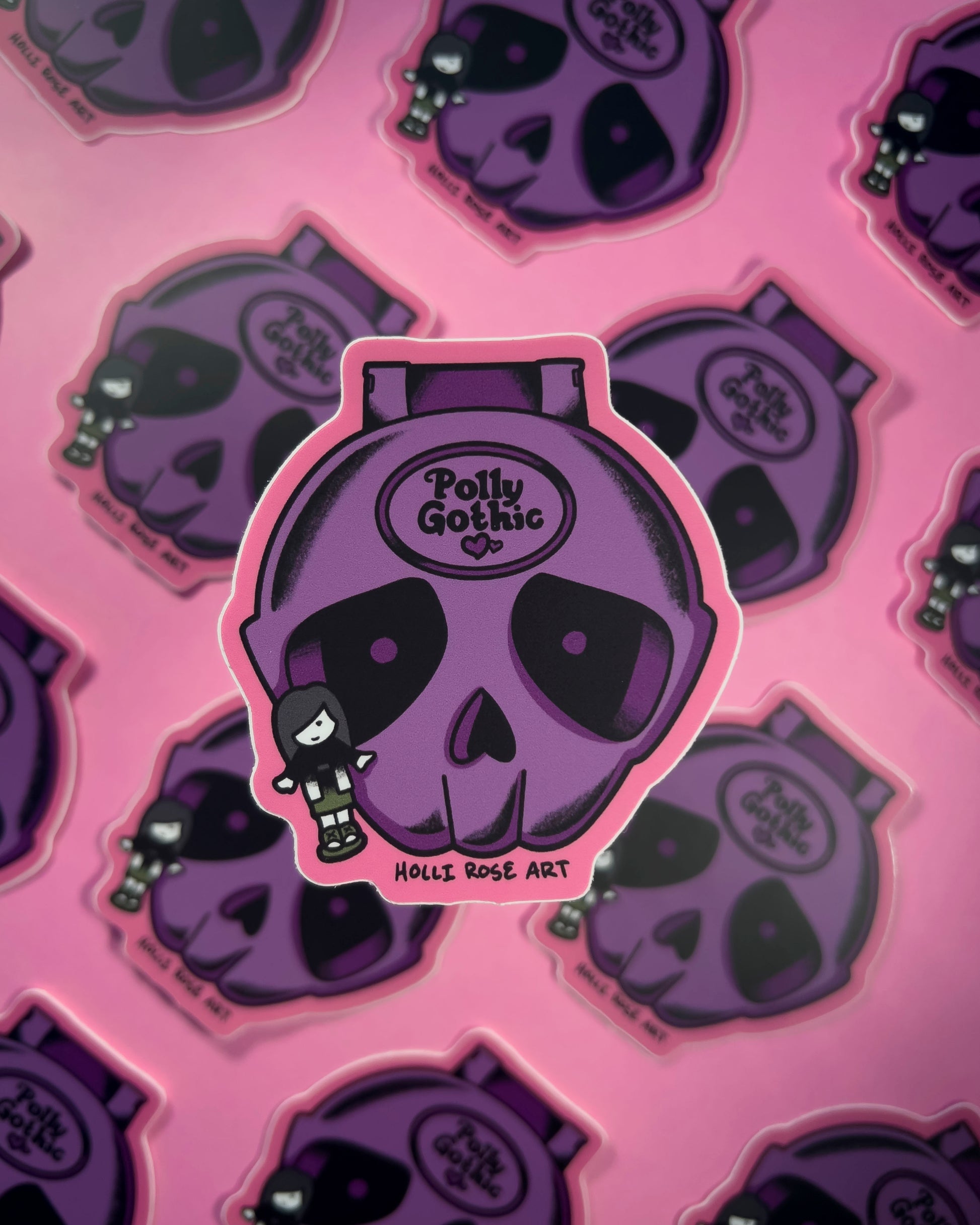 Sticker with a skull design and 'Polly Gothic' branding on a pink background.