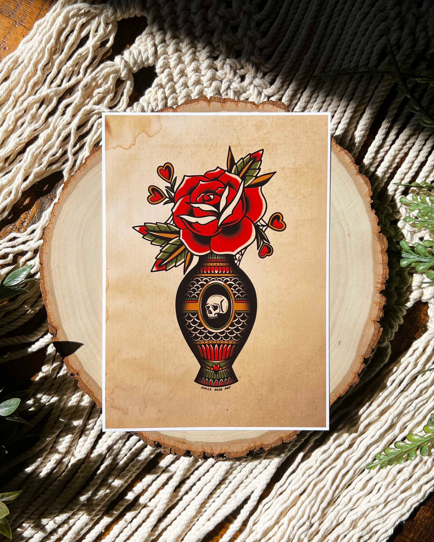 a print of an American traditional rose in a vase