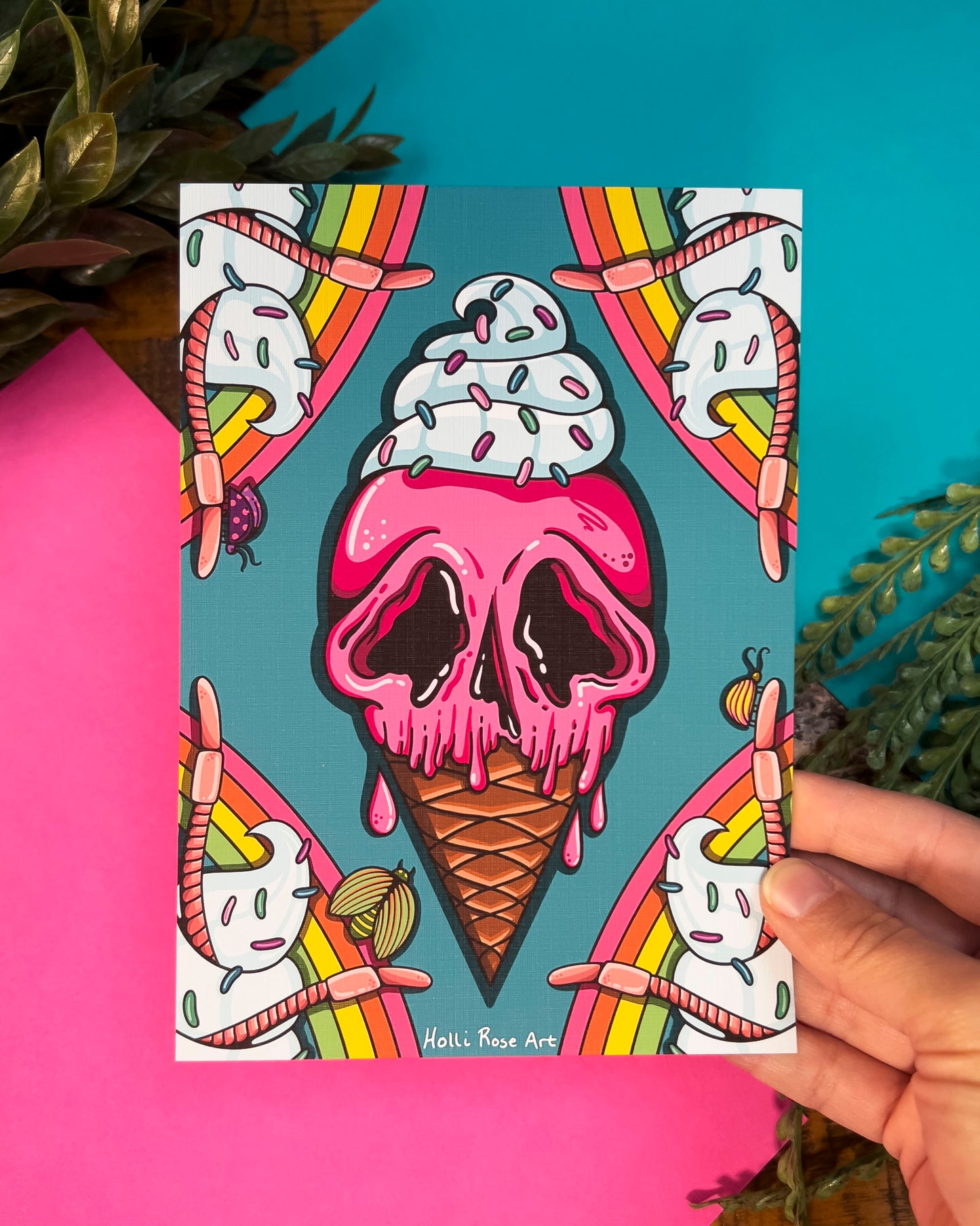 an ice cream cone looking like a skull art print with rainbows in the background