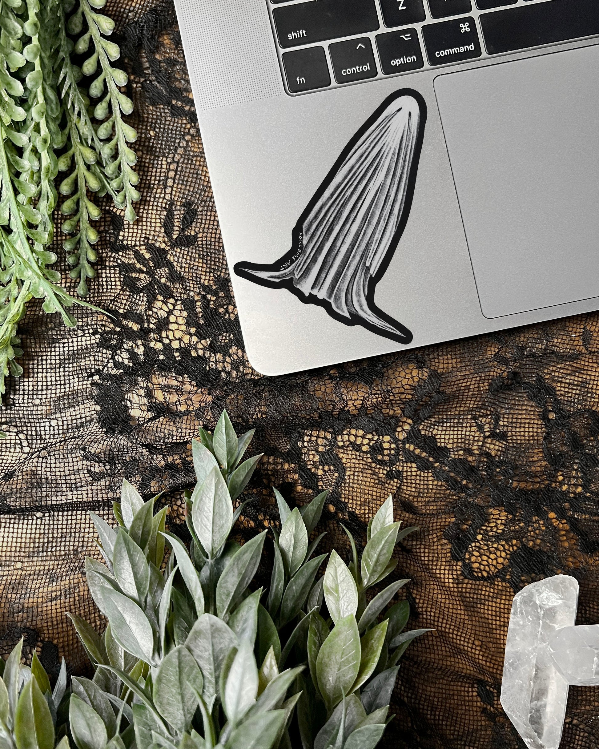 sheet ghost sticker on a laptop