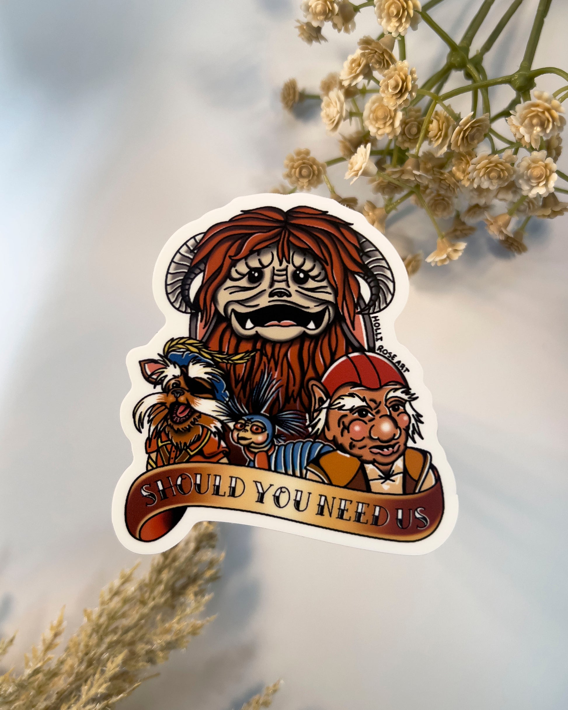 sticker with labyrinth characters and they saying "should you need us"
