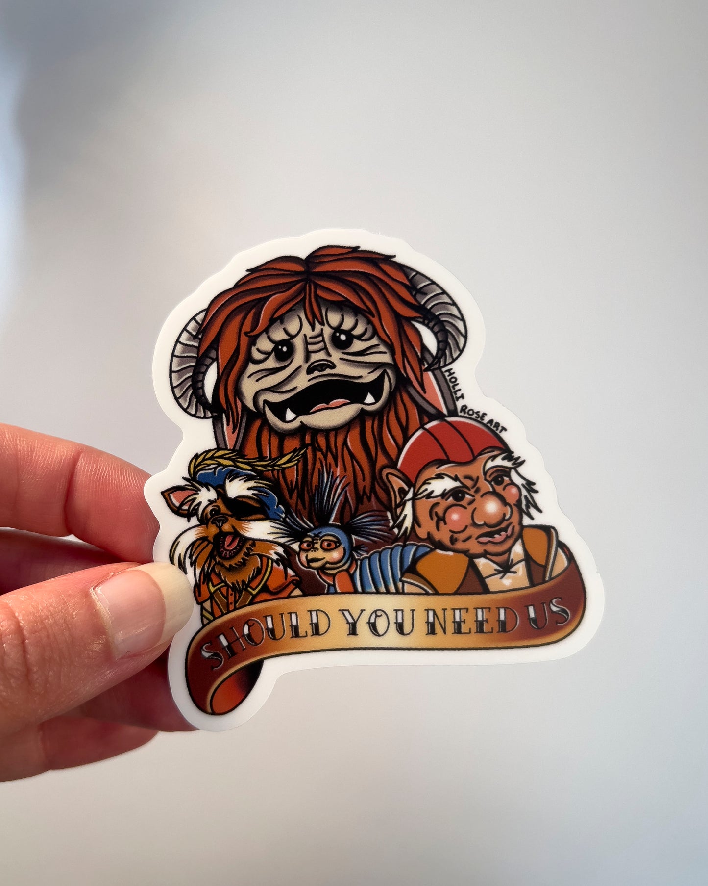 sticker with labyrinth characters and they saying "should you need us"