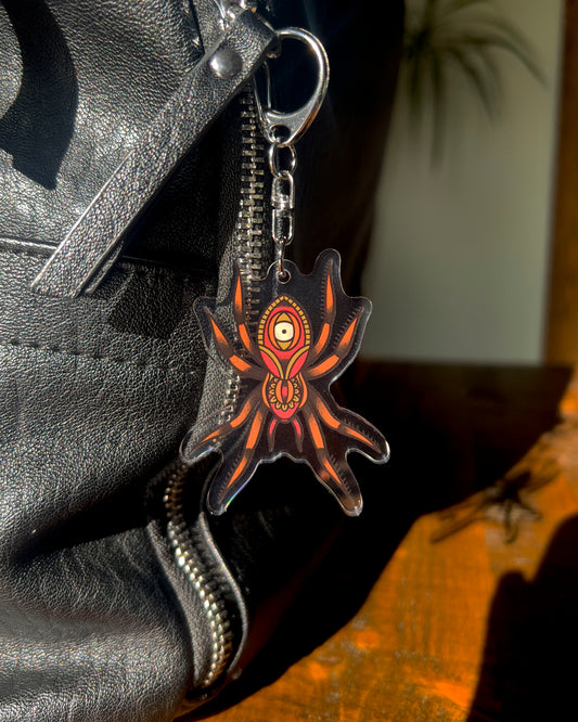 Keychain of a spider with an eye on it's back