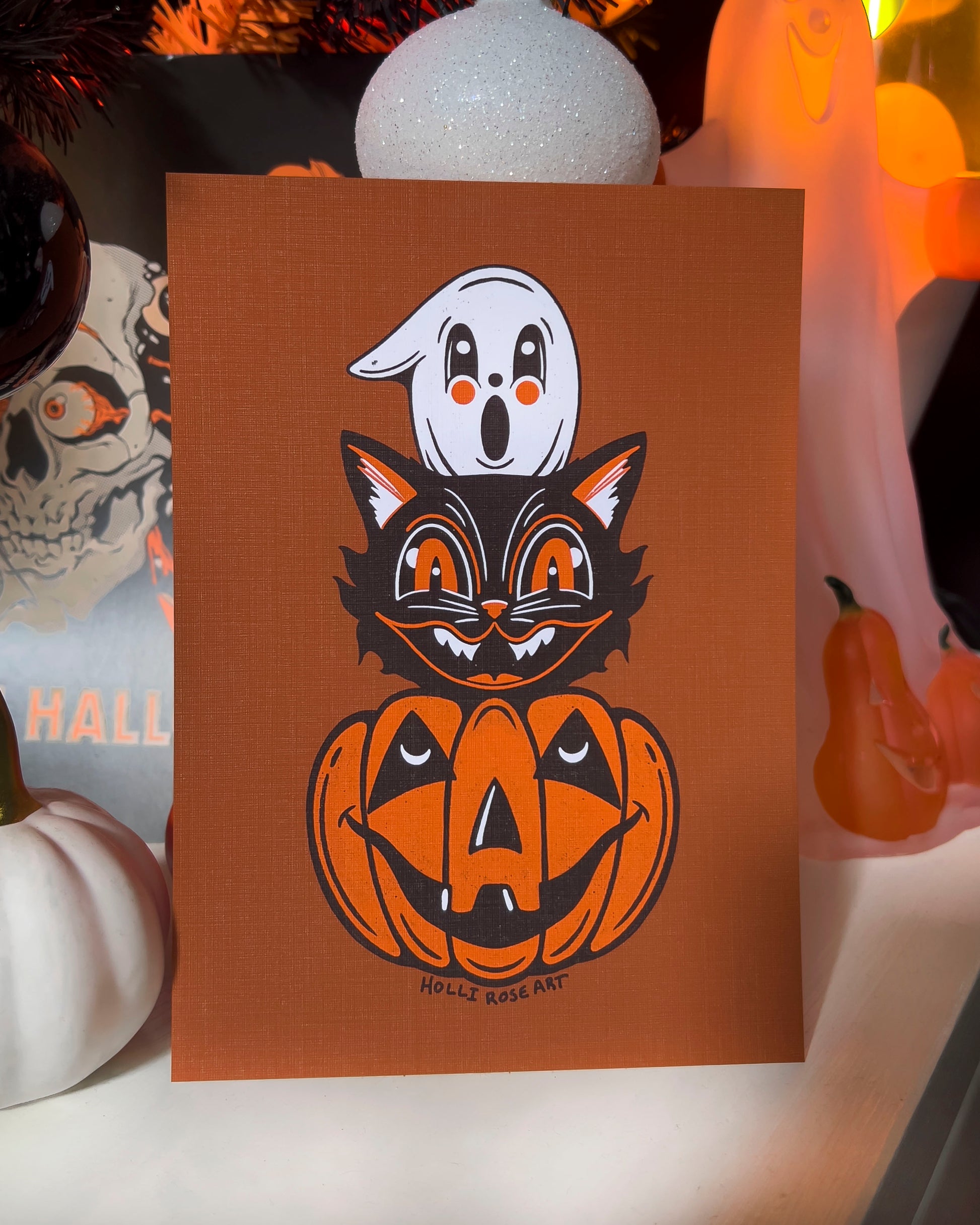 Halloween themed drawing art print with a ghost, cat and pumpkin head stacked on eachtoher