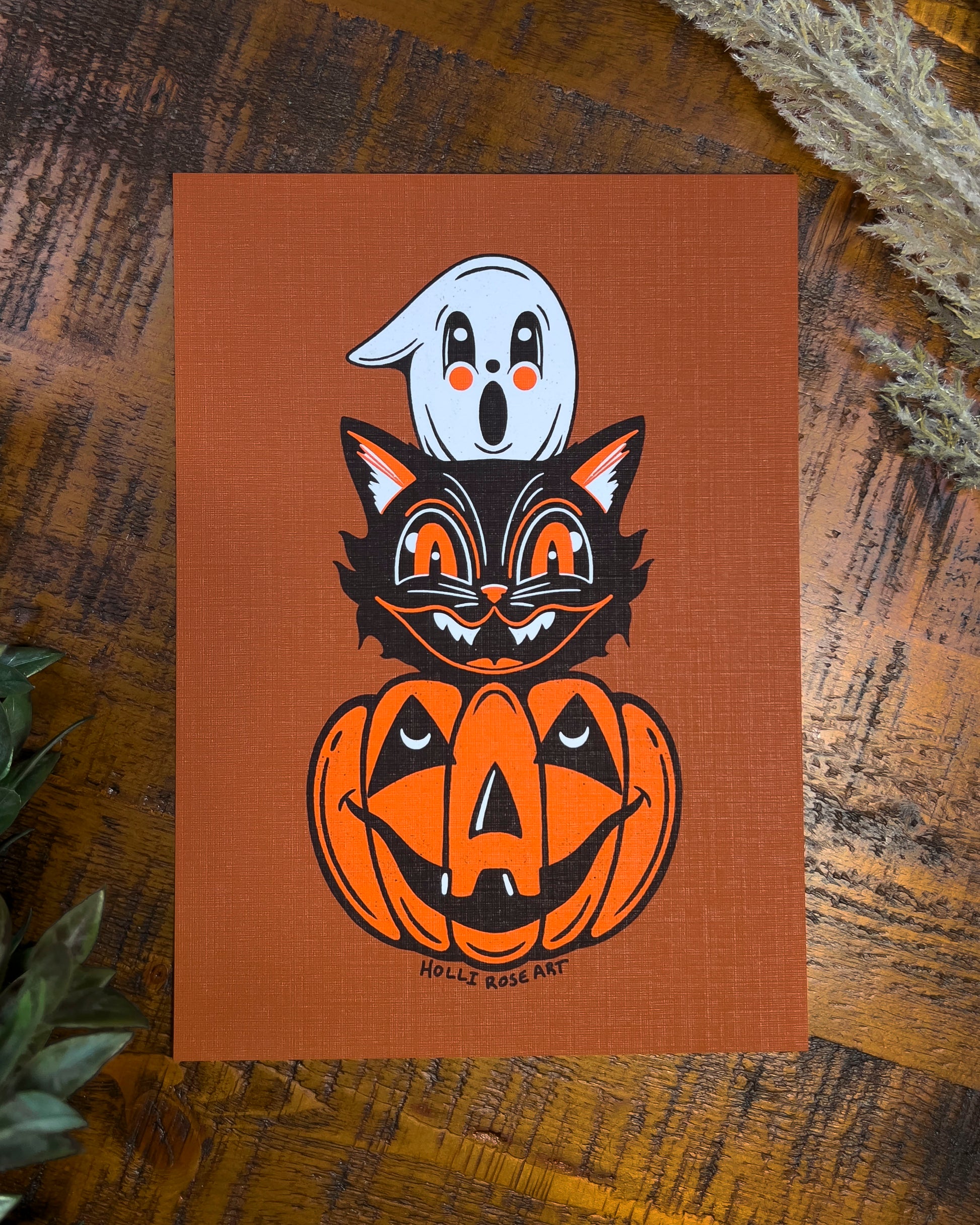 Halloween themed drawing art print with a ghost, cat and pumpkin head stacked on eachtoher