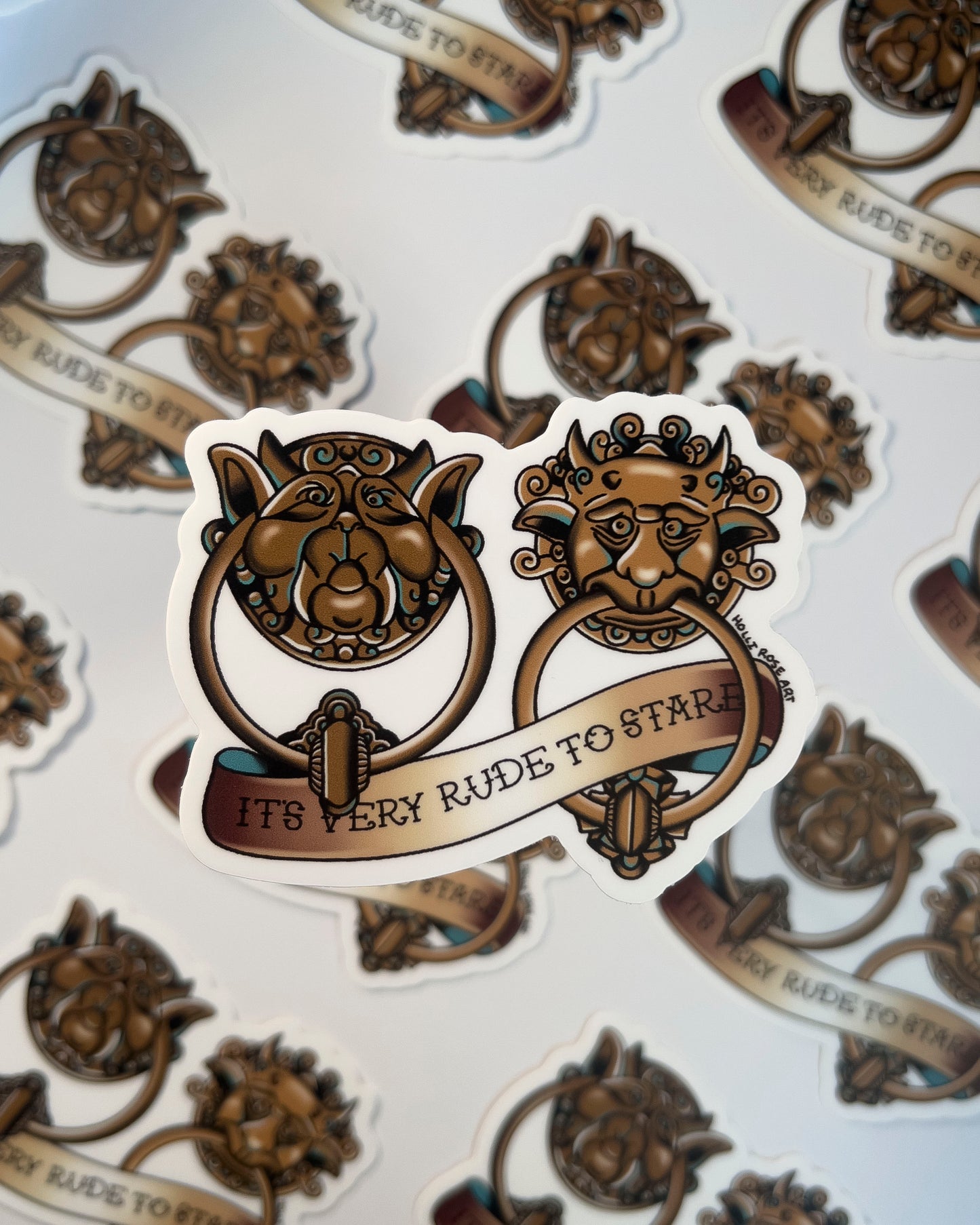 sticker of labyrinth doorknockers and the saying "it's very rude to stare"