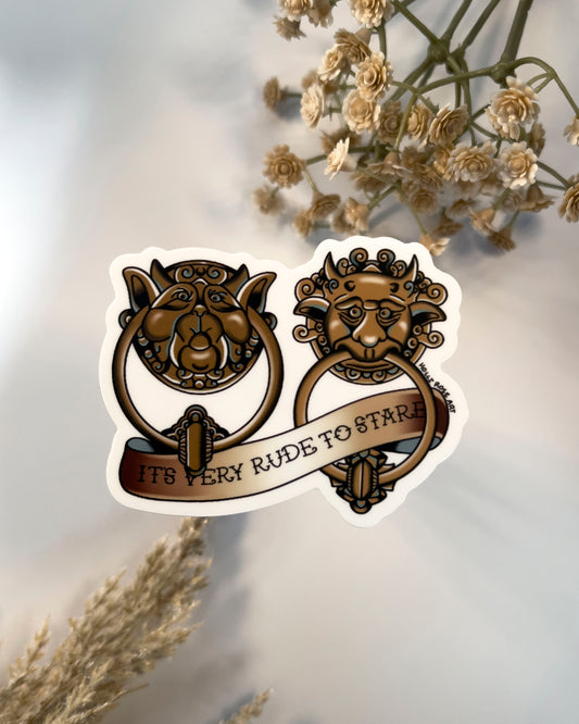 sticker of labyrinth doorknockers and the saying "it's very rude to stare"