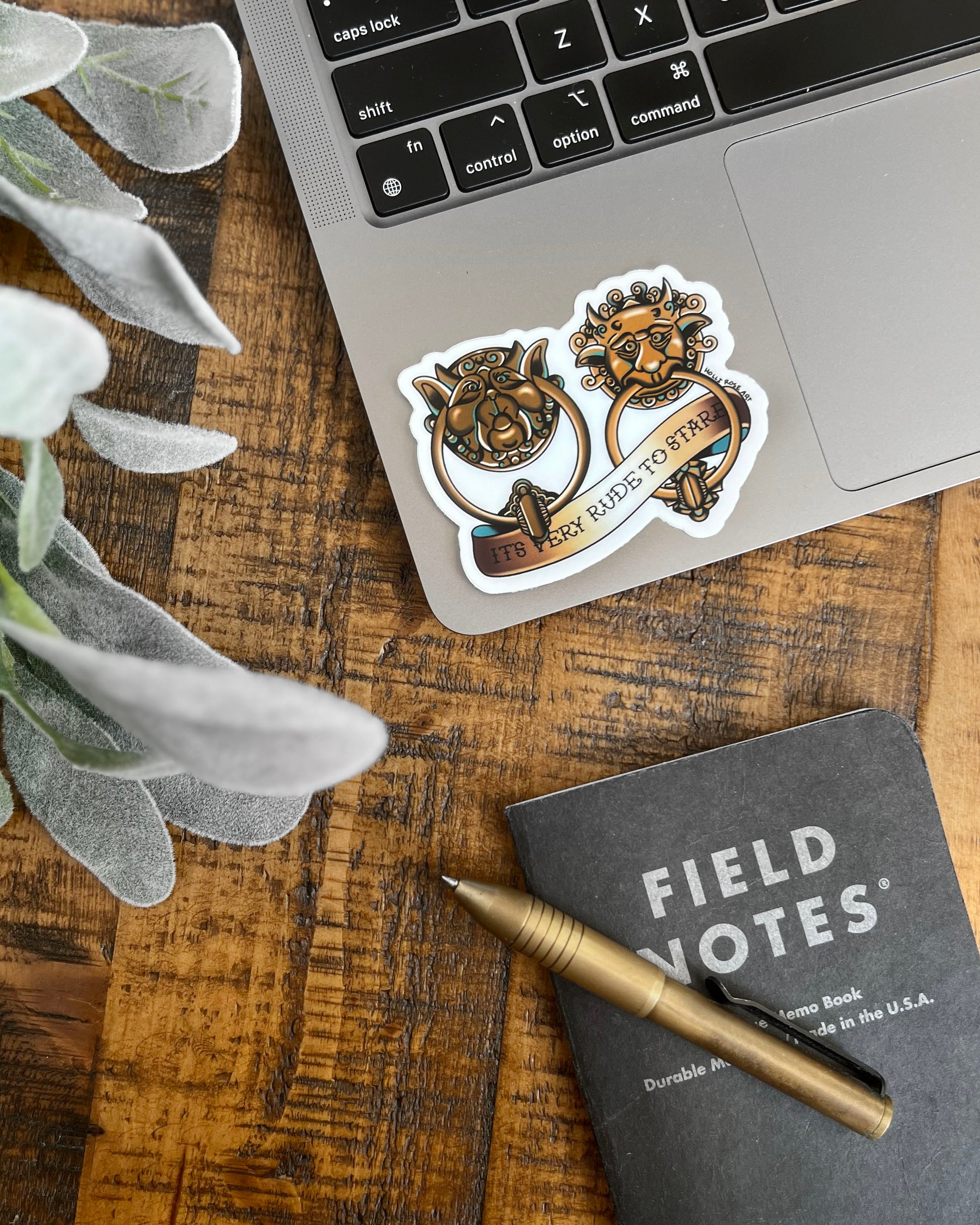 sticker of labyrinth doorknockers and the saying "it's very rude to stare"