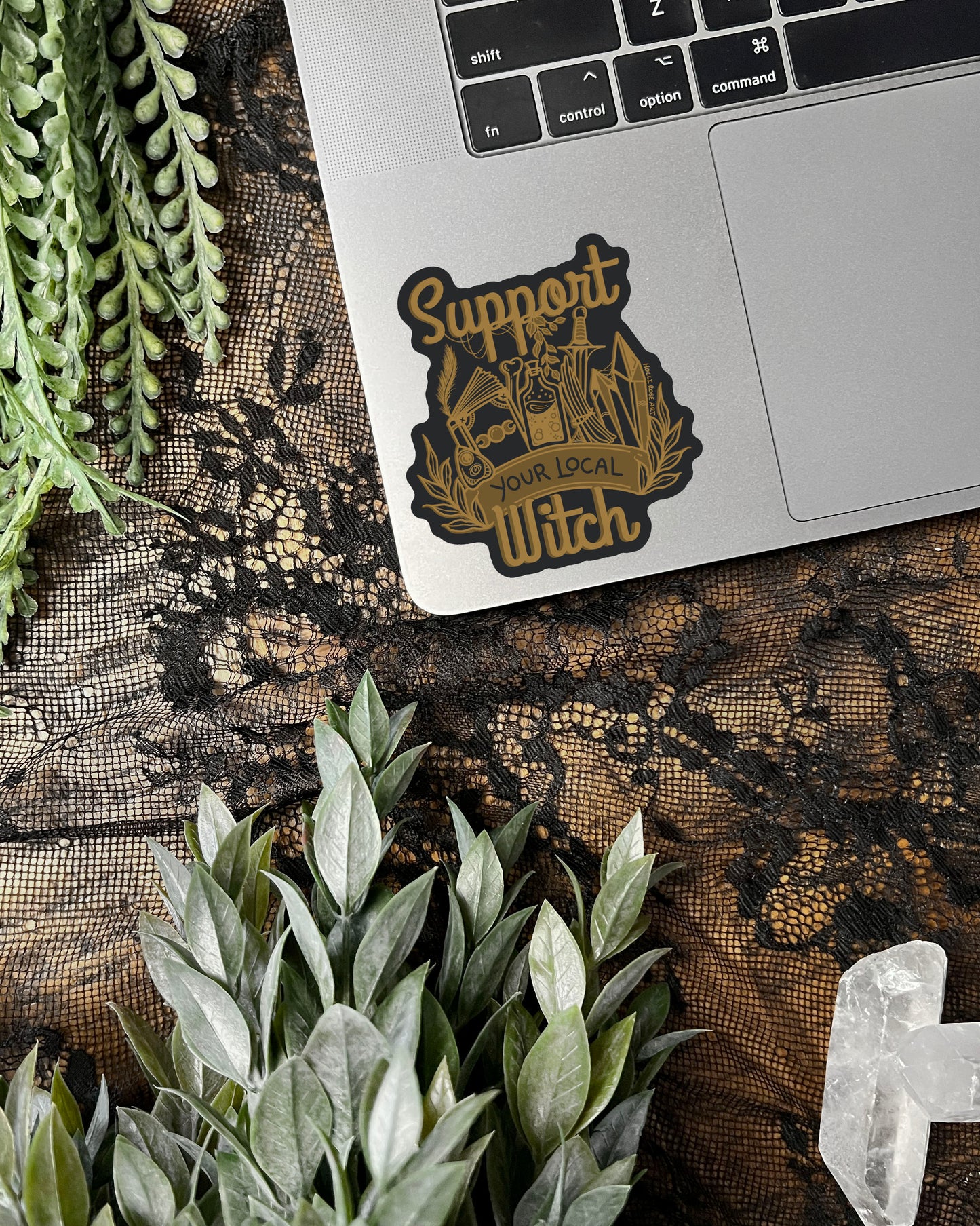 a sticker that says support your local witch with witchy elements 