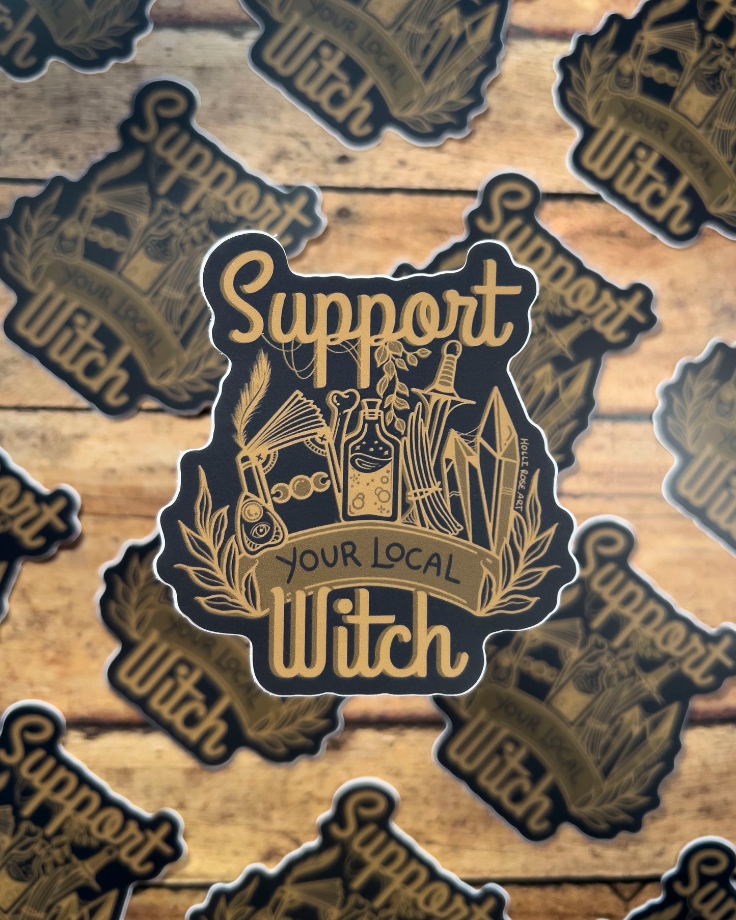 a sticker that says support your local witch with witchy elements 
