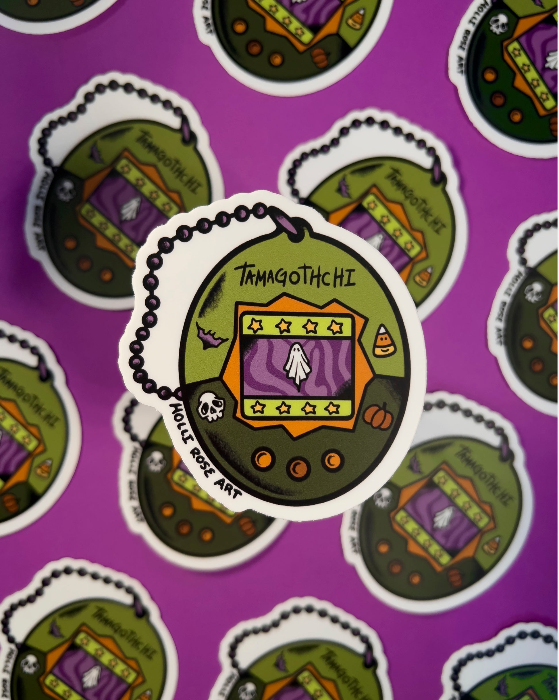 classic tamagotchi design but with a ghost on it sticker