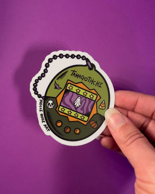 classic tamagotchi design but with a ghost on it sticker