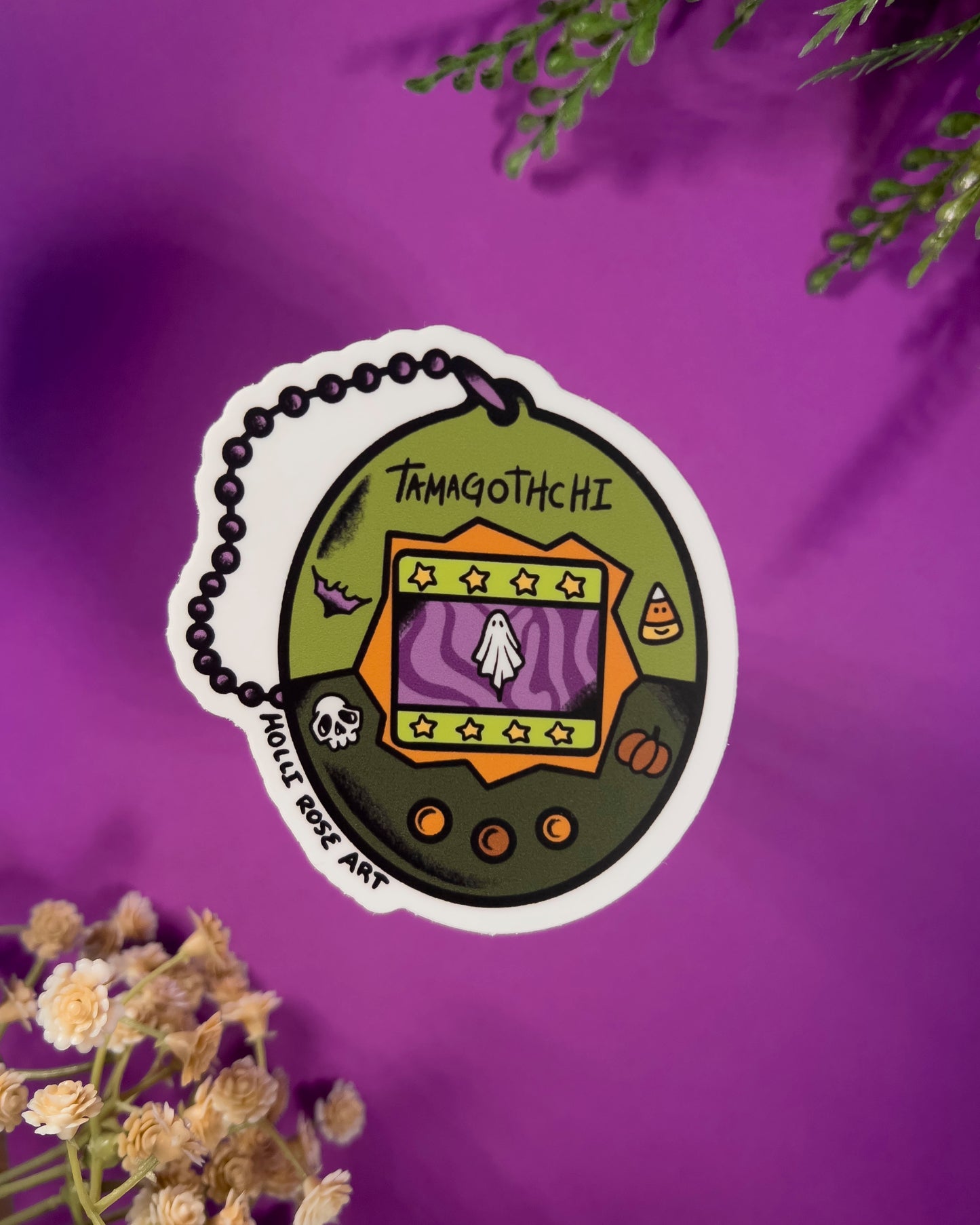 classic tamagotchi design but with a ghost on it sticker
