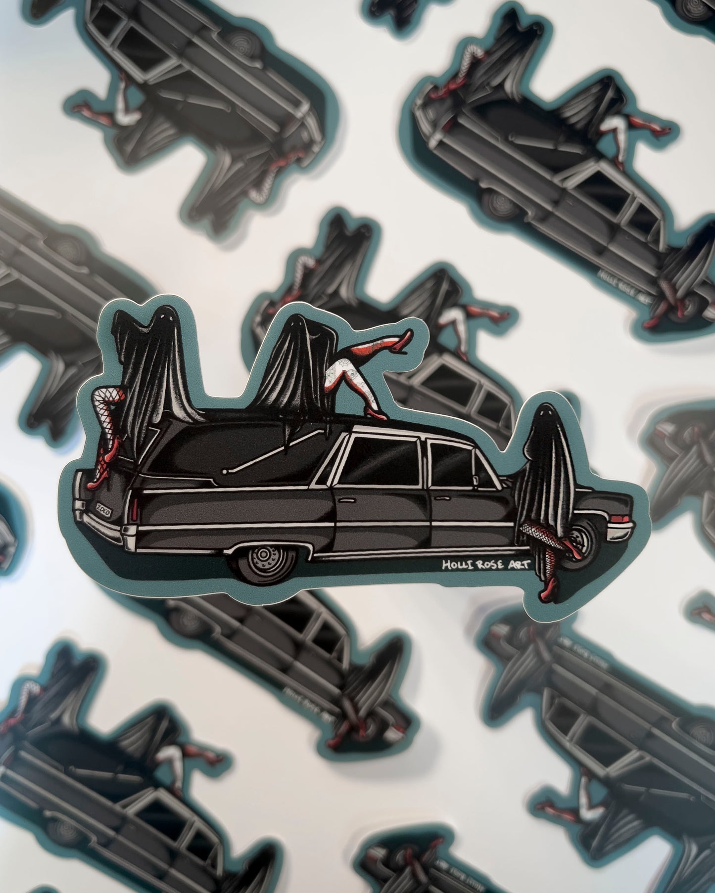 a hearse with 3 sexy ghost girls on it sticker