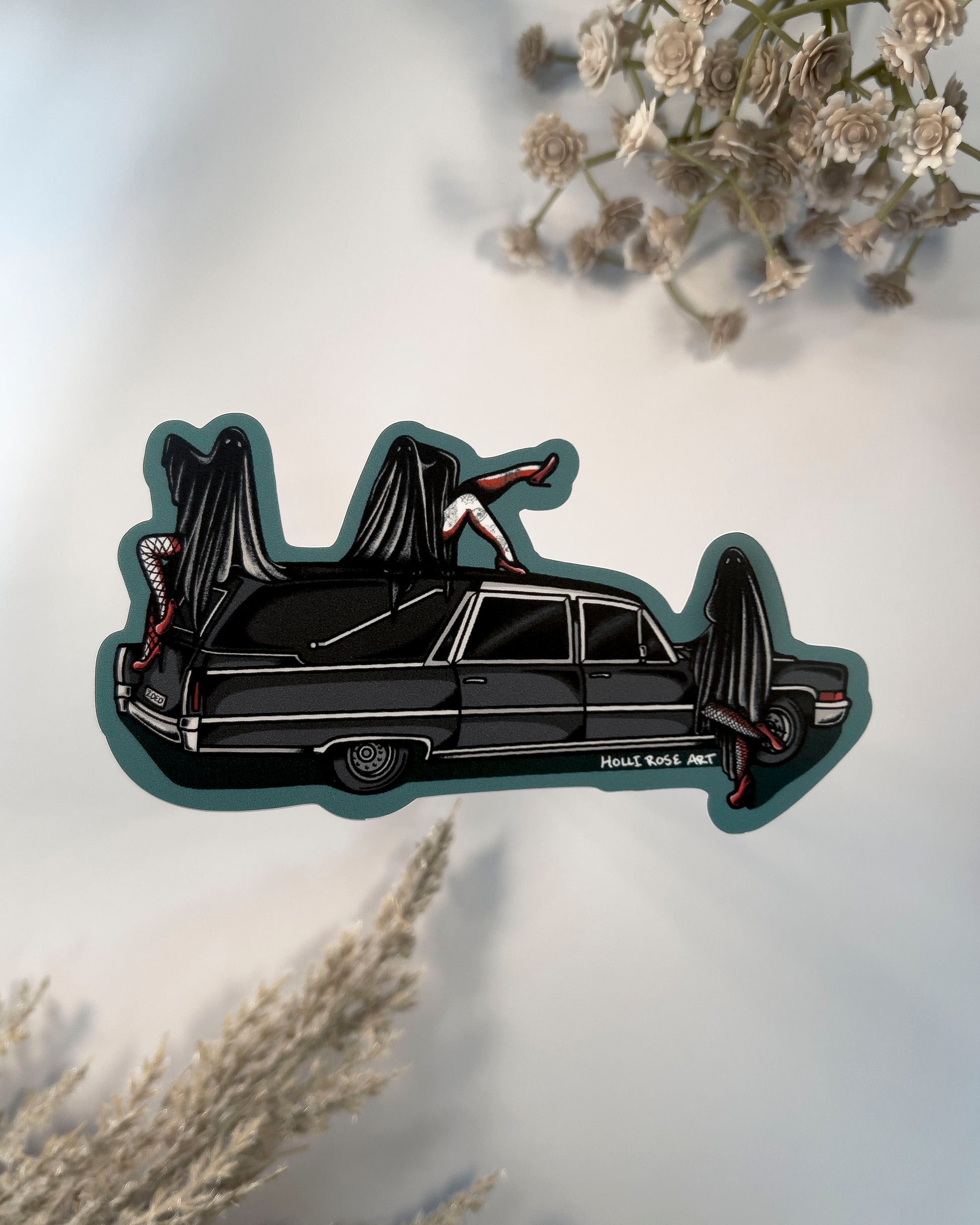 a hearse with 3 sexy ghost girls on it sticker