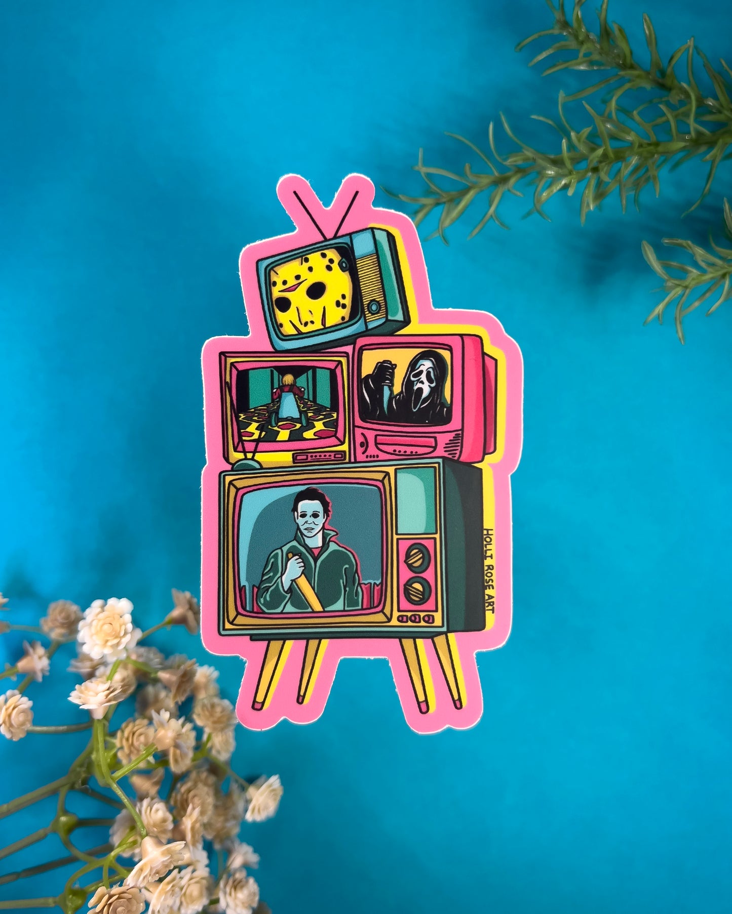 A sticker with tvs stacked and horror characters in pink, blues and yellows