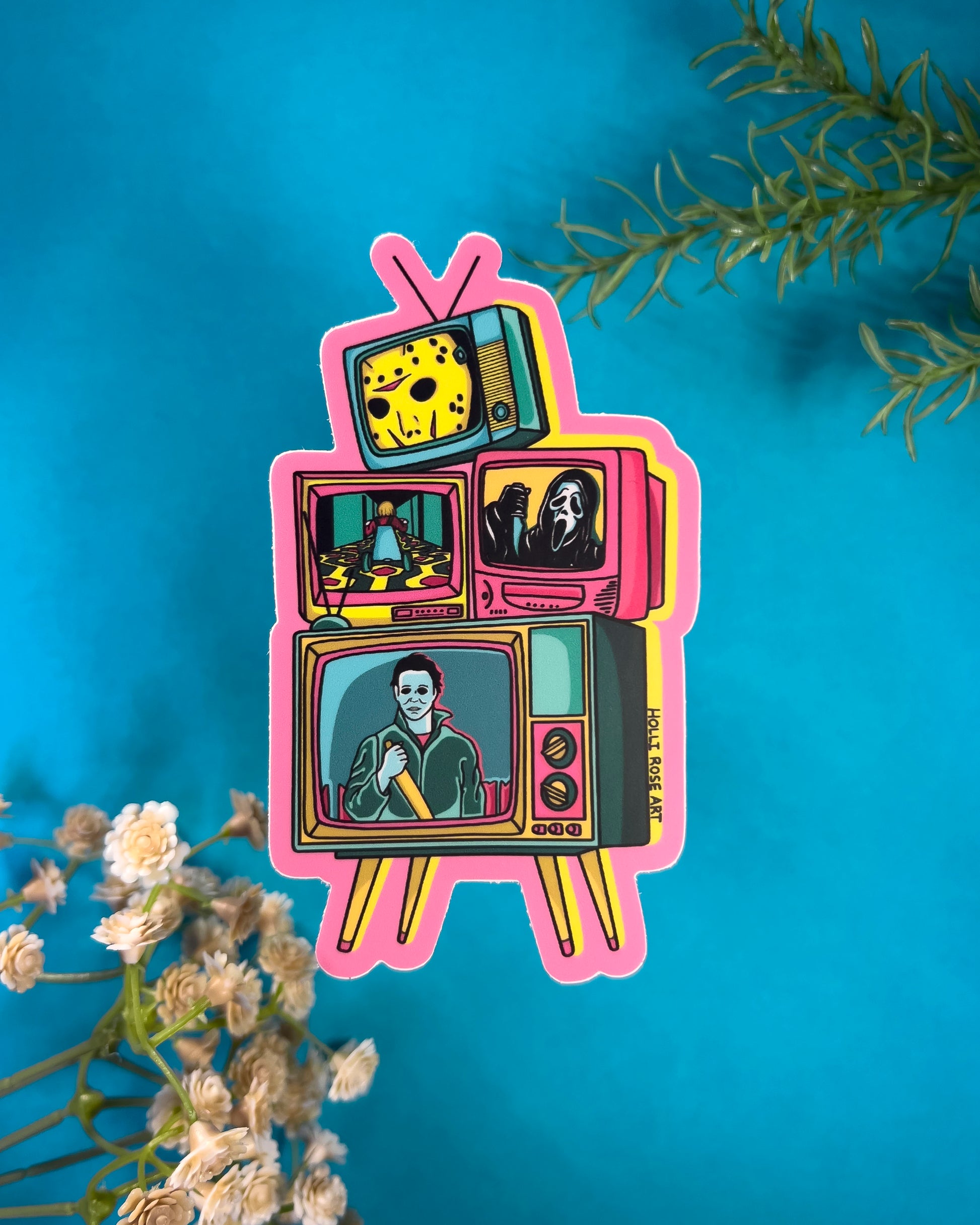 A sticker with tvs stacked and horror characters in pink, blues and yellows