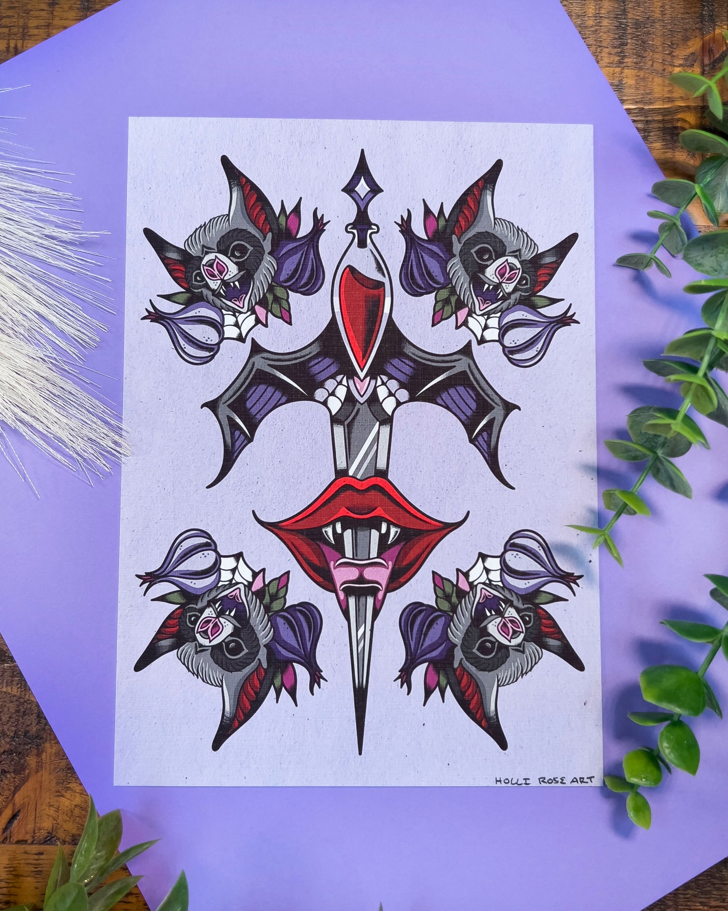 a dagger going through a vampire mouth and bats and garlic on each corner print