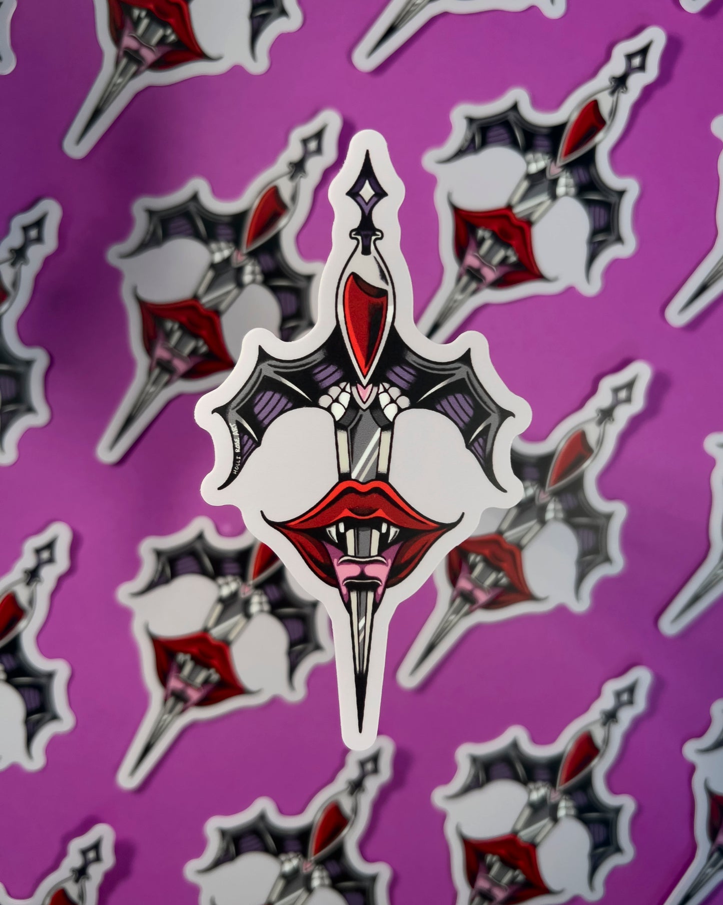 Decorative sticker with a design of a sword, heart, and lips